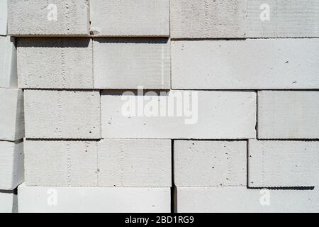 blocks of cellular concrete are stacked in a pile Stock Photo