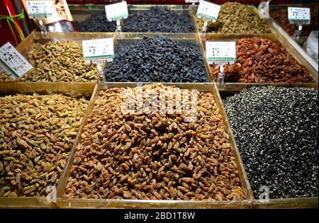 Locally grown grapes dried into raisins and sultanas, for sale in Shazhou market, Dunhuang, Gansu, China, Asia Stock Photo