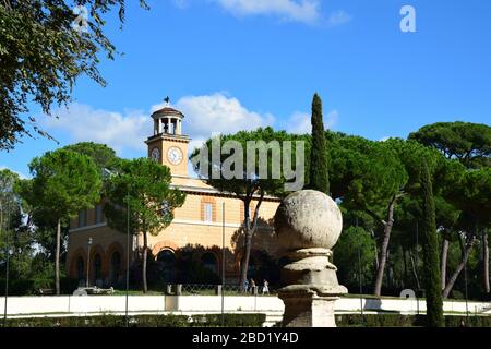 Casina dell'Orologio and Piazza di Siena in the Villa Borghese Park in the city of Rome, Italy Stock Photo