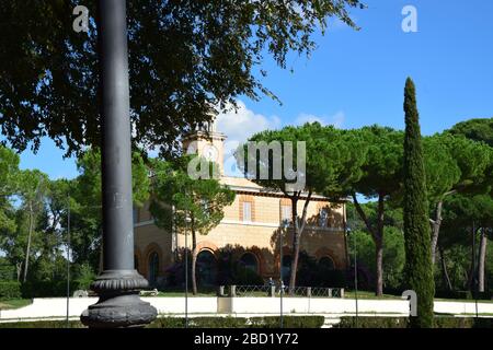 Casina dell'Orologio and Piazza di Siena in the Villa Borghese Park in the city of Rome, Italy Stock Photo