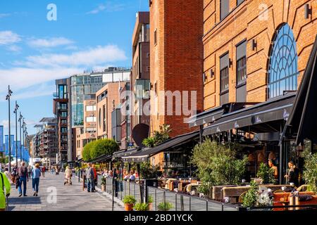 Oslo, Ostlandet / Norway - 2019/09/02: Panoramic view of modernistic Aker Brygge district of Oslo along Stranden boulevard at the Oslofjorden shore Stock Photo