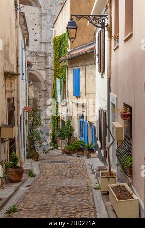 Pretty side street, the Rue Renan, in Arles, leading on to the Arles Amphitheatre Stock Photo