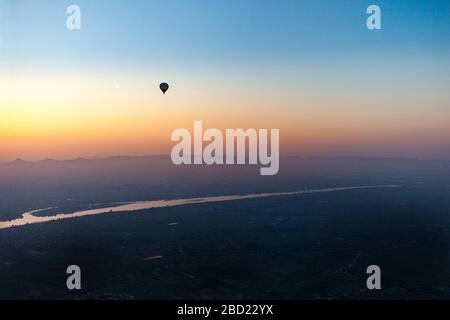 Hot air balloon over the river Nile, Luxor, Egypt Stock Photo