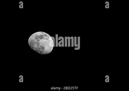 82.6% waxing gibbous Moon against black background with copy space Stock Photo