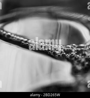 Bubbles formed on the surface of dish washing liquid soap in a bottle. Stock Photo