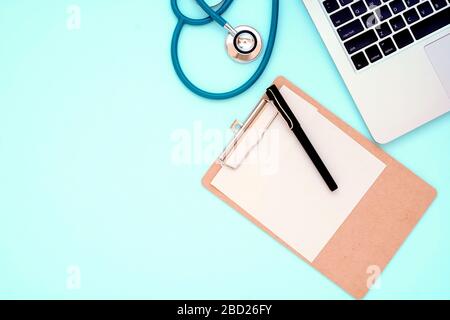 Vintage Stethoscope doctor equipment mockup on flat blue table top view background concept for hospital office workplace, isolate clinical object tool Stock Photo