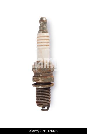 Studio shot of an old, rusty car spark ply cut out against a white background Stock Photo