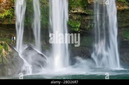 Agua Azul Cascades, visitors on trail behind waterfall, Chiapas, Mexico Stock Photo