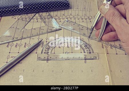 Electrical engineer workplace - electrotechnical project, rulers, and divider compass. Construction and electrotechnology concept. Engineering tools Stock Photo