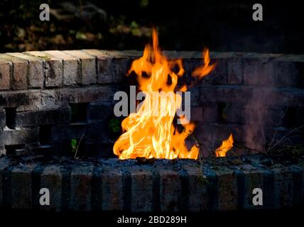 A fire in a burn pit Stock Photo