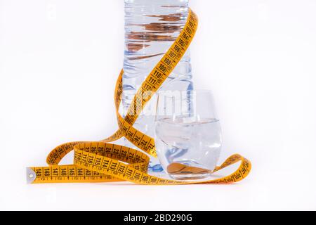 yellow tape measure and a water bottle Stock Photo