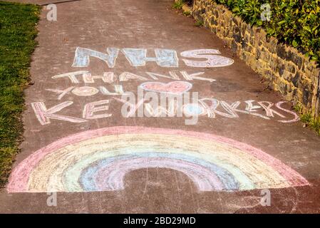 Southend on Sea, Essex, UK. 6th Apr, 2020. Messages of support for the hard working National Health Service staff and key workers are appearing in the roads leading to Southend University Hospital during the COVID-19 Coronavirus pandemic lockdown period. Rainbow trail Stock Photo