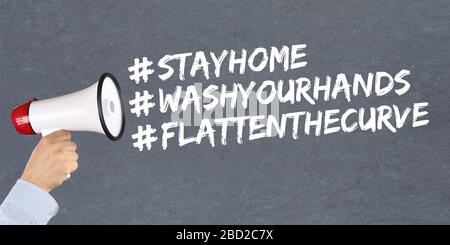 Stay home hashtag stayhome flatten the curve Coronavirus corona virus disease ill illness megaphone hand Stock Photo