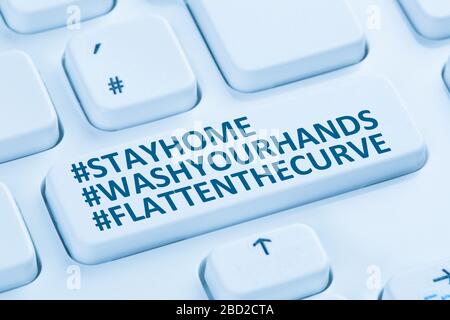 Stay home hashtag stayhome flatten the curve Coronavirus corona virus infection computer keyboard internet Stock Photo