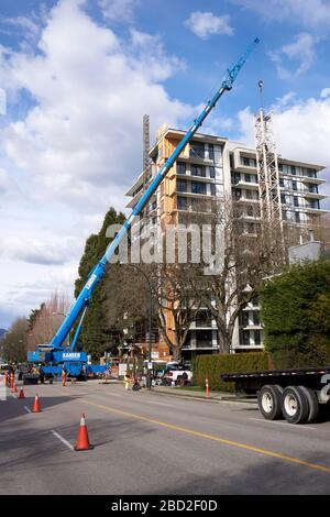 A tall telescopic crane at a construction site in Vancouver, BC, Canada Stock Photo
