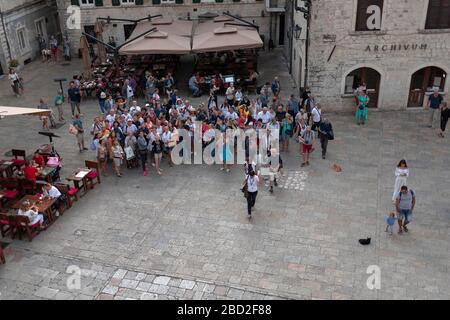 Montenegro, Sep 22, 2019: A large group of tourists at the Saint Tryphon Square in Kotor Old Town Stock Photo