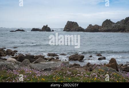 The Carns, and distant Western Rocks, viewed from Wingletang Downs on the Scillonian island of St Agnes Stock Photo