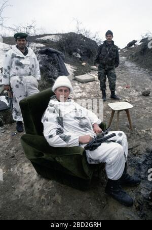 26th January 1994 During the war in central Bosnia: soldiers of the HVO's Rama Brigade relax after the battle in the Bosnian Muslim village of Here, captured two days earlier. Stock Photo