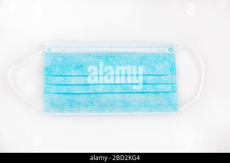 Protective medical surgical mask on a white background. Prevent hygiene products from coronavirus during quarantine during a pandemic. Mandatory perso Stock Photo