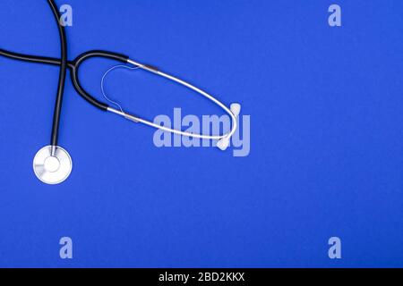 Stethoscope or phonendoscope isolated on blue background. Stock Photo