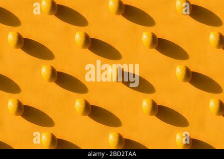 Fresh lemon pattern on a vivid yellow background Stock Photo
