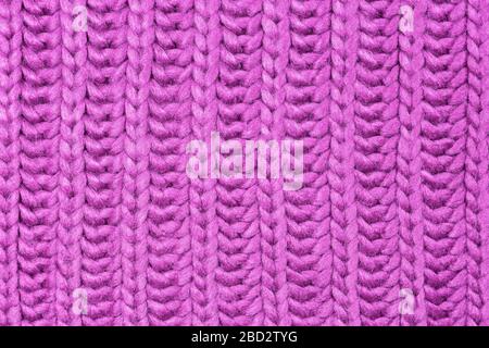 Close-up photo of pink knitted sweater background, texture with copy space. Good pattern for design. Stock Photo