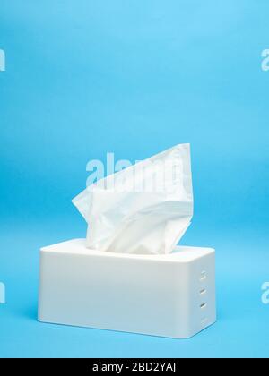 White napkin holder on minimalistic blue background Stock Photo