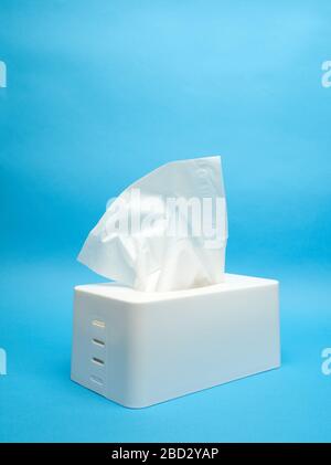 White napkin holder on minimalistic blue background Stock Photo