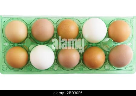 Multicolored chicken eggs in new plastic store packaging. Unequal Stock Photo