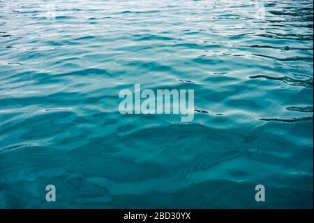 Turquoise ripple water surface on lake background Stock Photo
