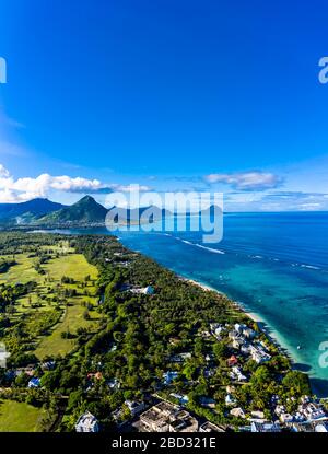 Aerial view, coastline with luxury hotel and palm trees, behind the mountain Tourelle du Tamarin, Flic en Flac, Mauritius