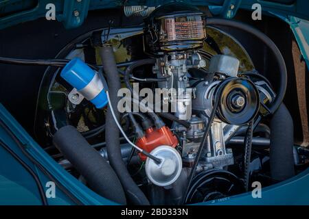 Old car engine on a classic VW Bug. Hood open Stock Photo
