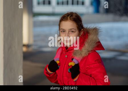 Close up portrait of a beautiful nine year old little girl. School child in winter clothes. Girl 9 years old. Teenager portrait. Girl in a red jacket Stock Photo Alamy