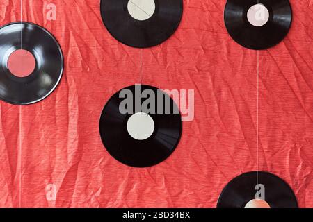 Many vinyl records on a red background Stock Photo