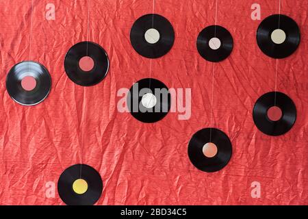 Many vinyl records on a red background Stock Photo