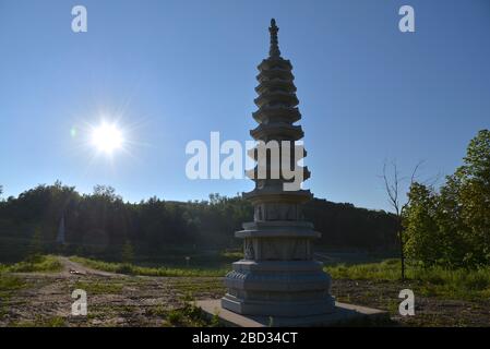 Pagoda in the garden of Buddhist temple Stock Photo