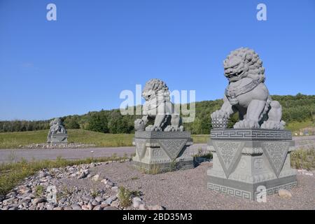 Chinese guardian lions as the architectural ornament placed in the entrance of the temple Stock Photo