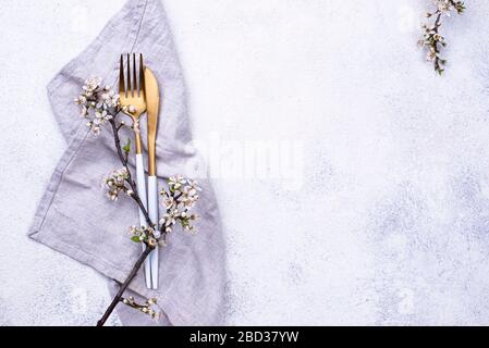 Spring table setting with blooming branch Stock Photo