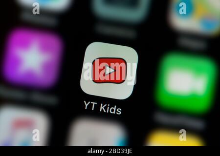A close-up shot of the Youtube Kids app icon, as seen on the screen of a smart phone (Editorial use only) Stock Photo
