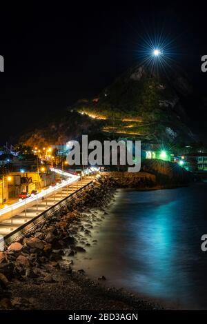 The road to the lighthouse lit up at night in Mazatlan, Sinaloa, Mexico. Stock Photo