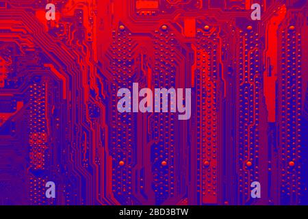 Blue and red electronic mother board circuit close up macro background. Stock Photo