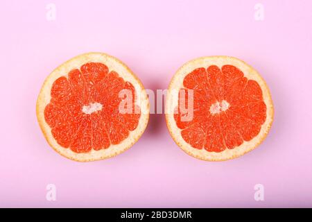 Fresh Red Grapefruit Slice On Blue Background Stock Photo