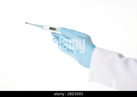 Close up hand in rubber latex medicine blue glove holding a electronic thermometer. Concept heat, malaise, fever, pain. Isolated on white background. Stock Photo