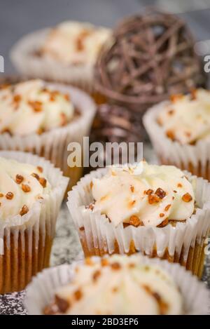 Homemade Carrot Cupcakes with Cream Cheese Frosting. Vegetable, muffins. Stock Photo