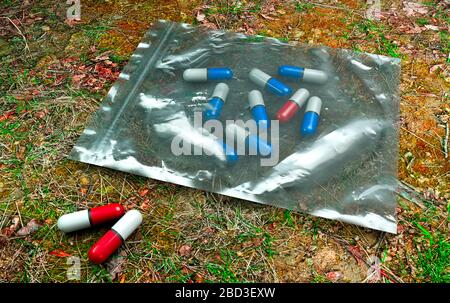 Pills, prescription, pills in a plastic bag. Medical content. Drug and drug dealing. Ecstasy amphetamine. 3d render Stock Photo