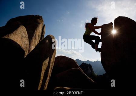 Female climber bouldering at Seroksan national park in South Korea Stock Photo