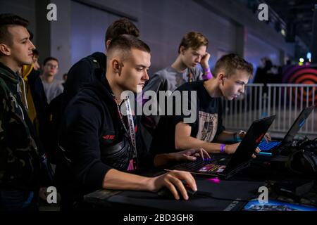 MOSCOW - DECEMBER 23 2019: esports Counter-Strike: Global Offensive event. Ex-professional gamer Denis siezed Kostin playing on a laptop with a fan at Stock Photo