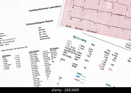 Close Up of Ecocardiography report (ECG) and a pulmonary Functions test with spirometry Stock Photo