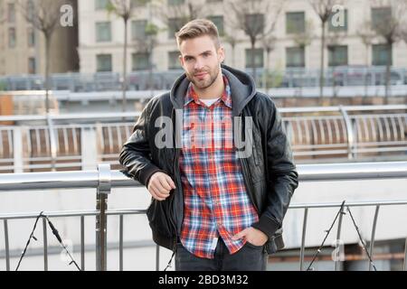 He likes autumn. Caucasian man on autumn day. Handsome guy wear 