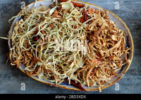 High view dried vegetables in basket, ingredient for many Vietnamese dishes, make dry from carrot, kohlrabi, radish Stock Photo